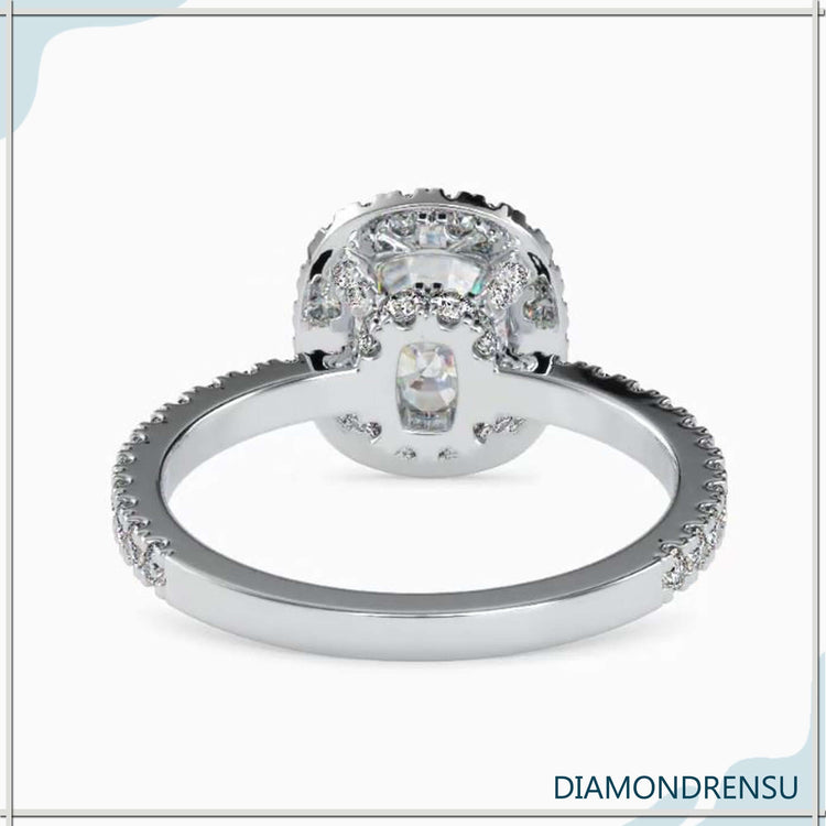 Handmade jewellery UK cushion halo engagement ring.
