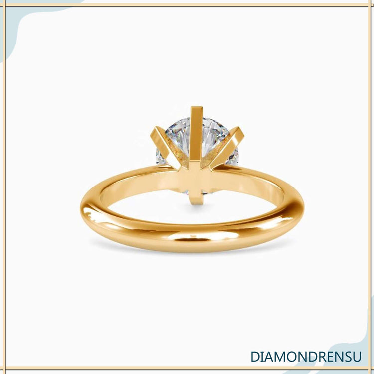 IGI certified solitaire diamond ring with yellow gold band.
