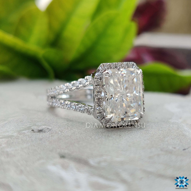 Handmade moissanite ring with radiant center stone.
