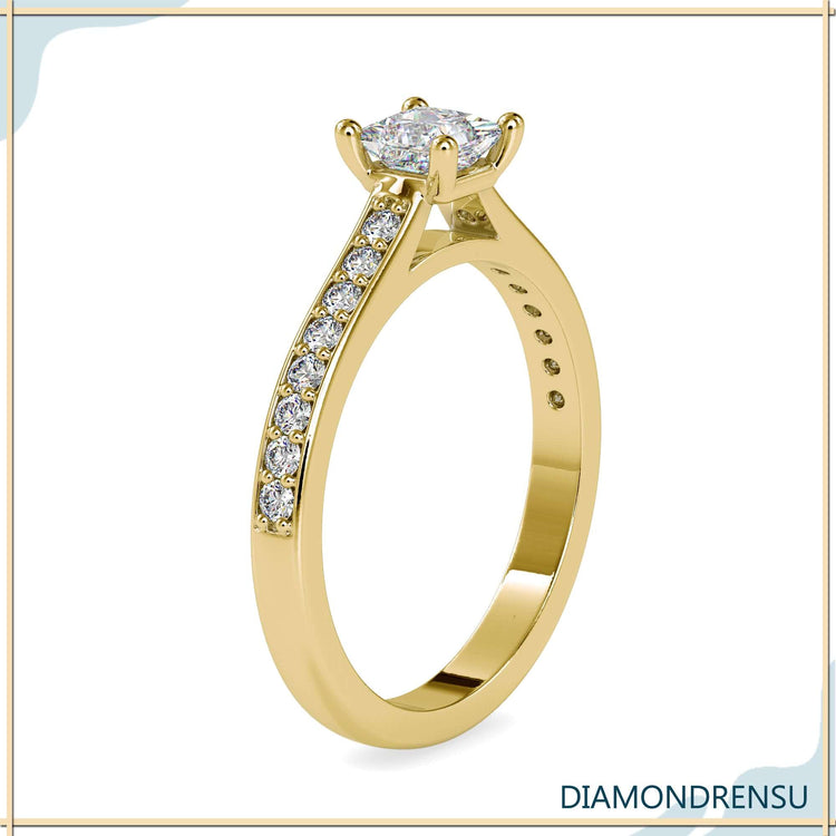 Princess centre stone ring with handmade detailing.
