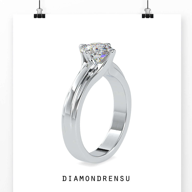 White gold engagement ring featuring a simple diamond ring design.

