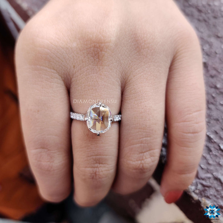 Rose cut moissanite ring with hidden halo and pave band.
