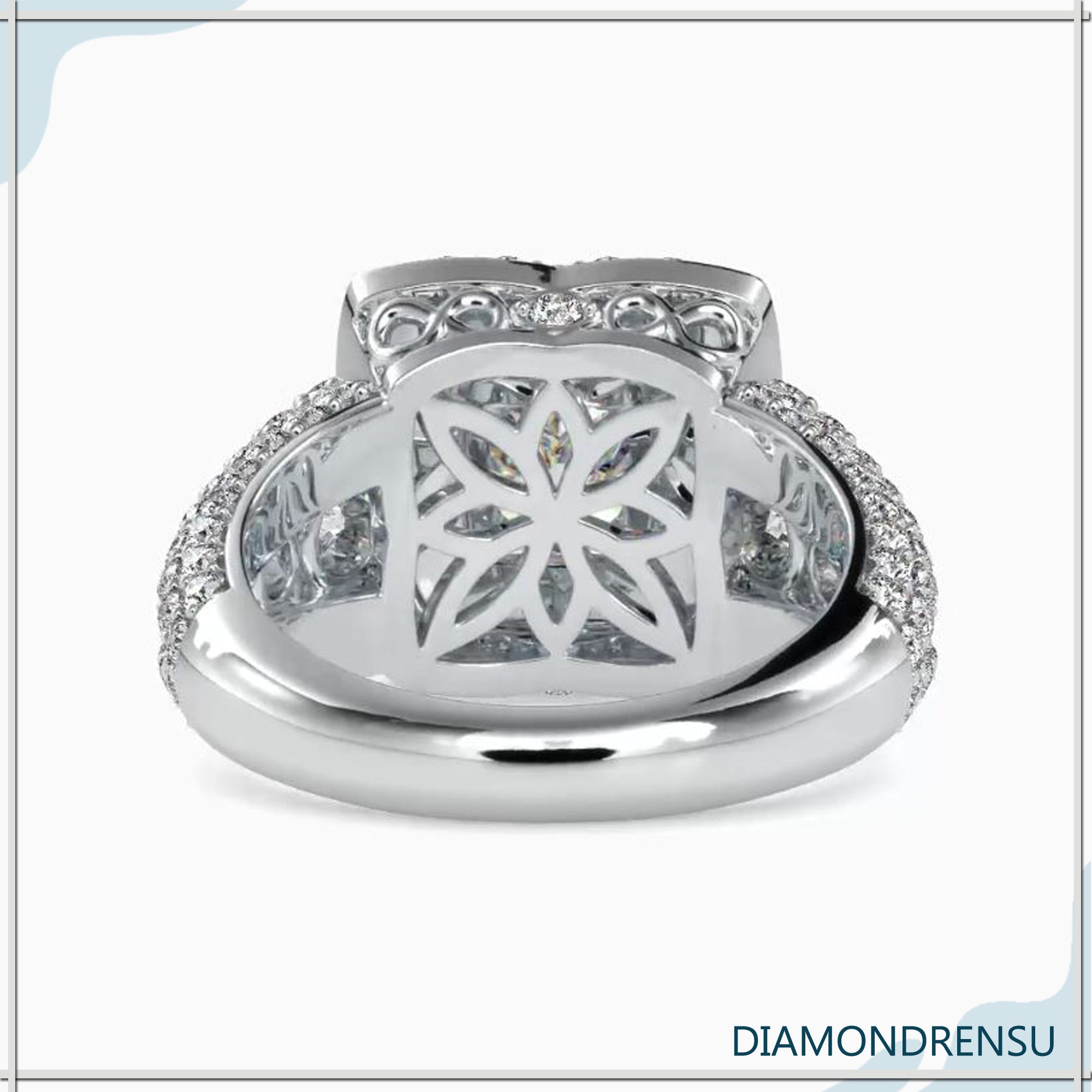 Side stone engagement ring featuring a princess cut diamond and brilliant side stones.
