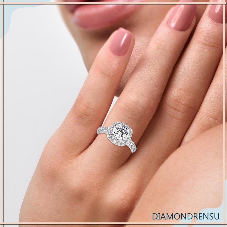 Cushion cut diamond ring with double row pave detailing.
