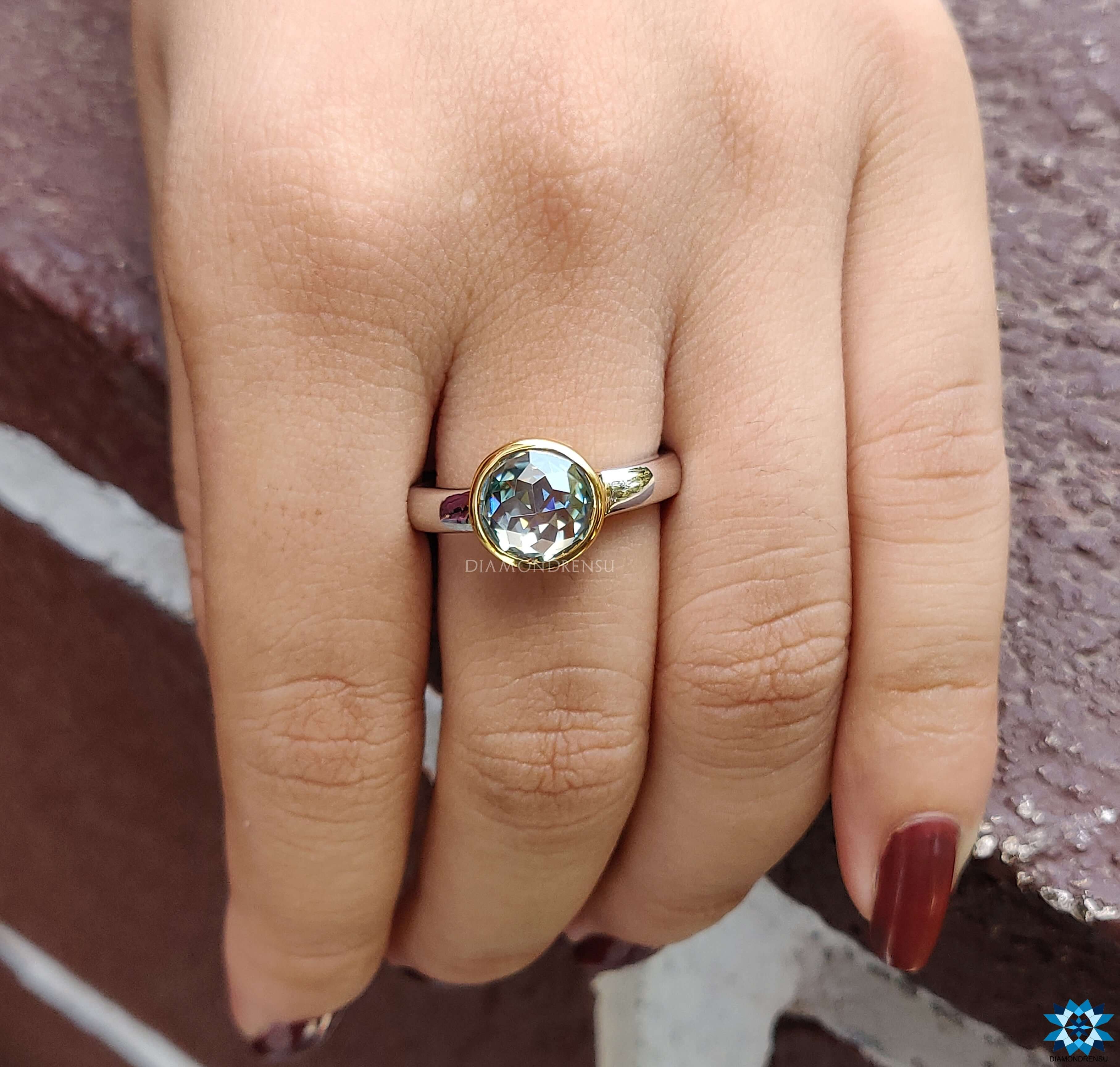 Two tone ring featuring a Moissanite Solitaire Ring for added elegance.