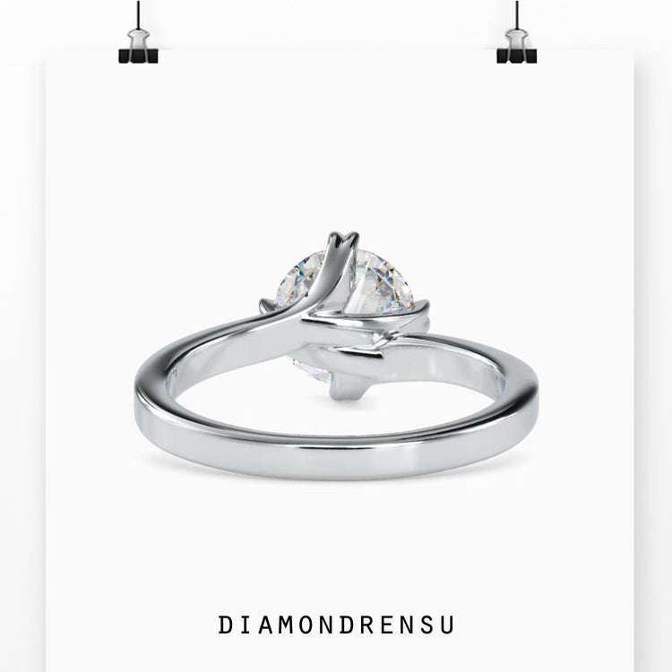 Rose gold engagement ring with round solitaire diamond.
