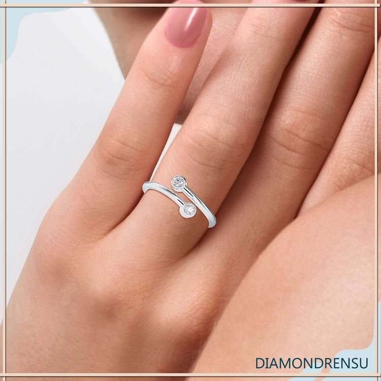 Two stone wedding band in rose gold with bezel setting.

