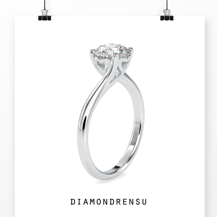 Rose gold engagement ring with round diamond solitaire.
