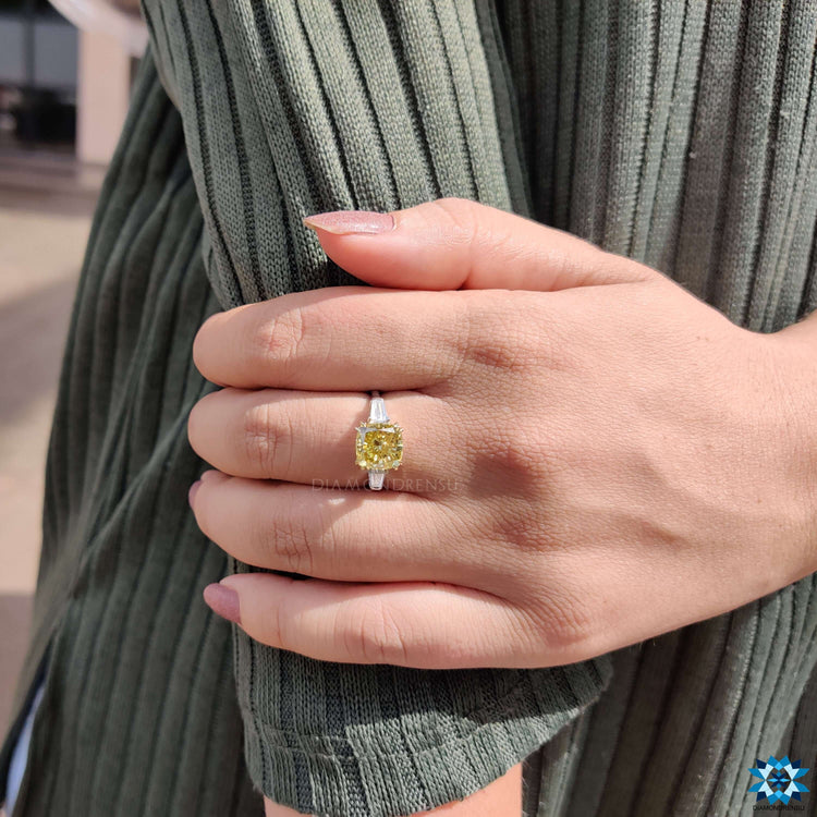 Three stone engagement ring with cathedral setting.
