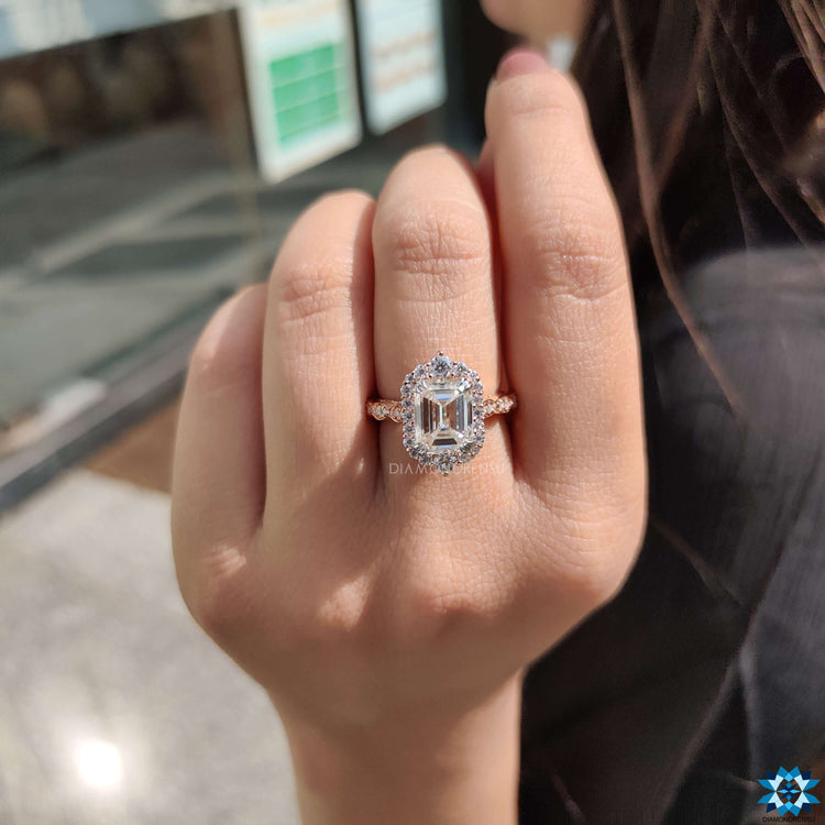 Vintage emerald cut moissanite ring in two tone gold.
