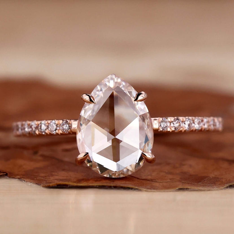 Pear shaped diamond ring crafted with elegance and featuring a claw prong engagement ring design.