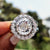Vintage engagement ring with Portuguese cut moissanite and split shank band.
