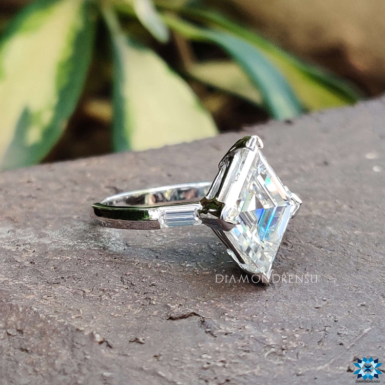 Four V prong setting on white gold moissanite ring.
