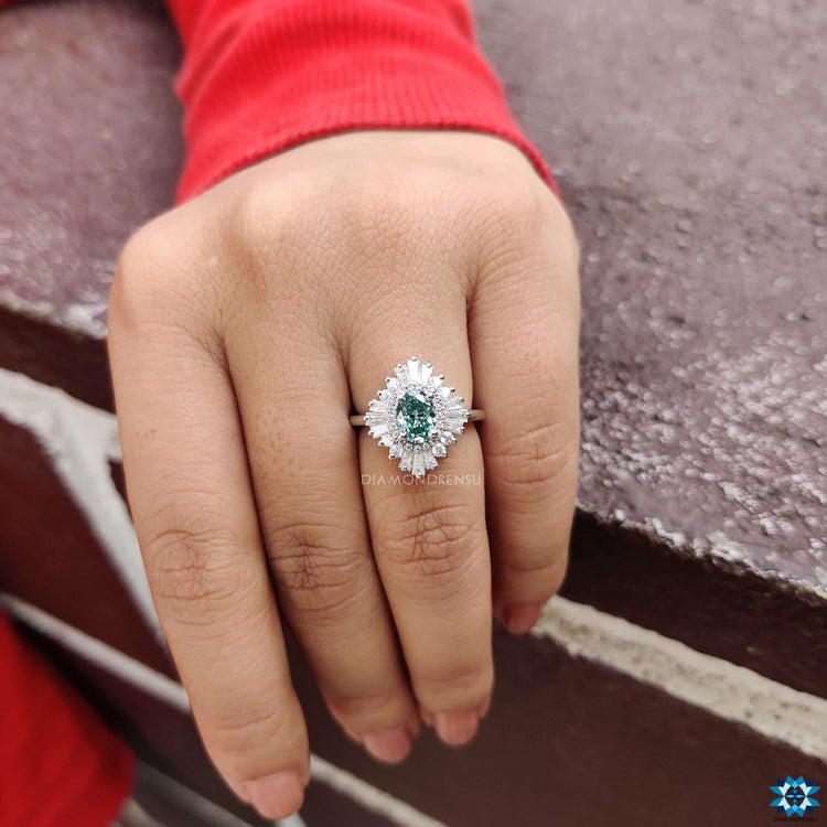 Custom engagement ring with cyan blue oval moissanite.
