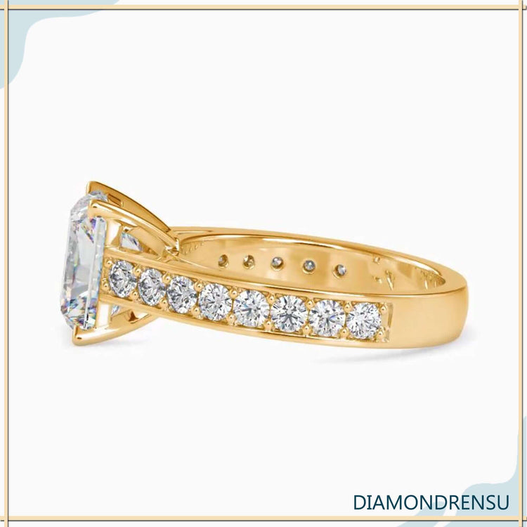 UK engagement ring featuring radiant cut and pave setting.
