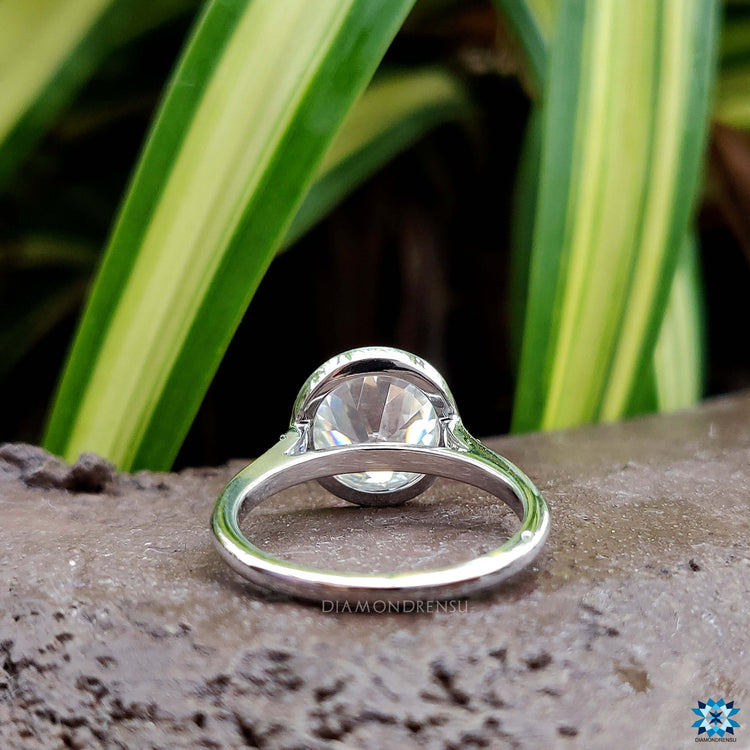 Moissanite engagement ring in white gold setting.
