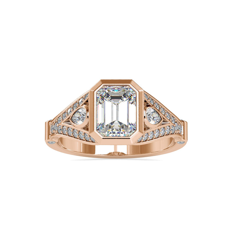 White gold ring with three stone emerald and pear design.
