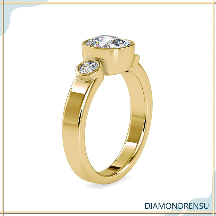 Buy engagement ring with cushion centre and side stones.
