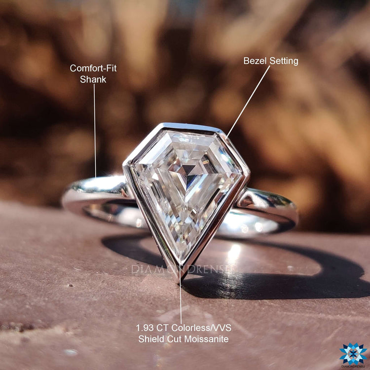Bezel solitaire ring crafted in white gold.
