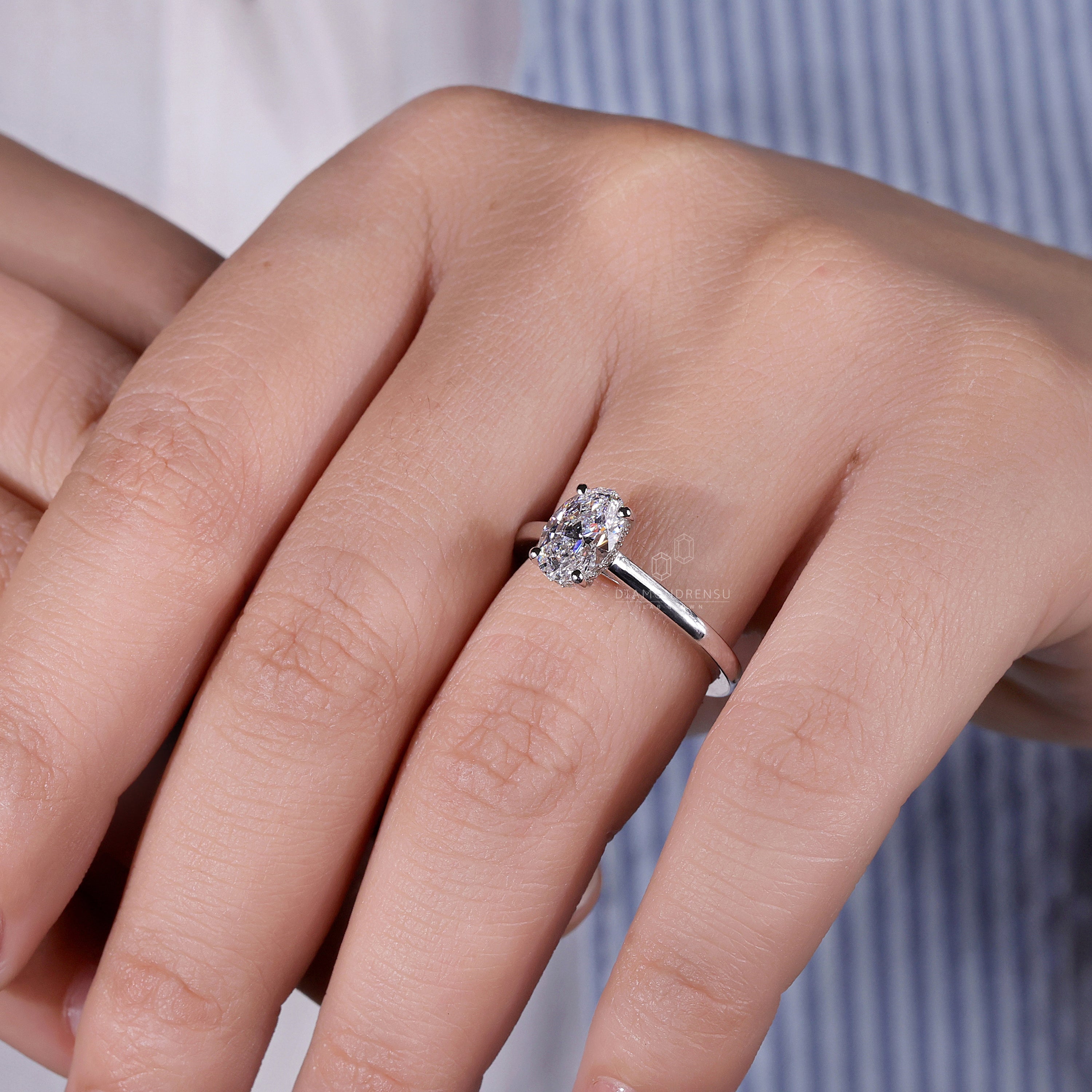 White gold hidden halo engagement ring crafted to perfection.