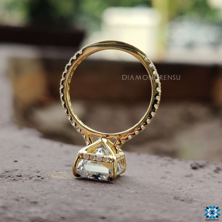Custom yellow gold ring with radiant moissanite.
