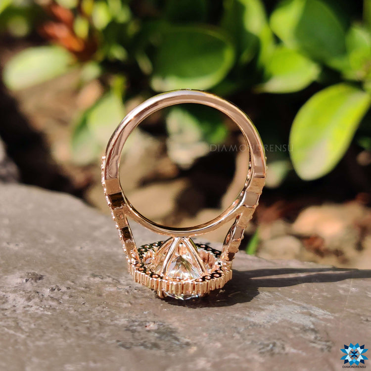 Cathedral setting ring with oval moissanite stone.
