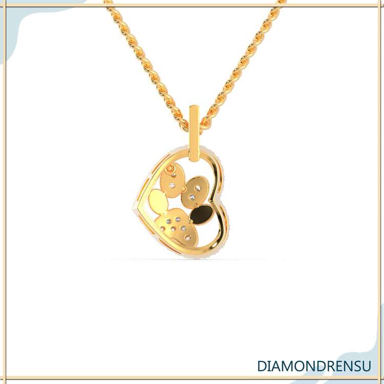 Handmade pendant with heart and paw symbols in rose gold.
