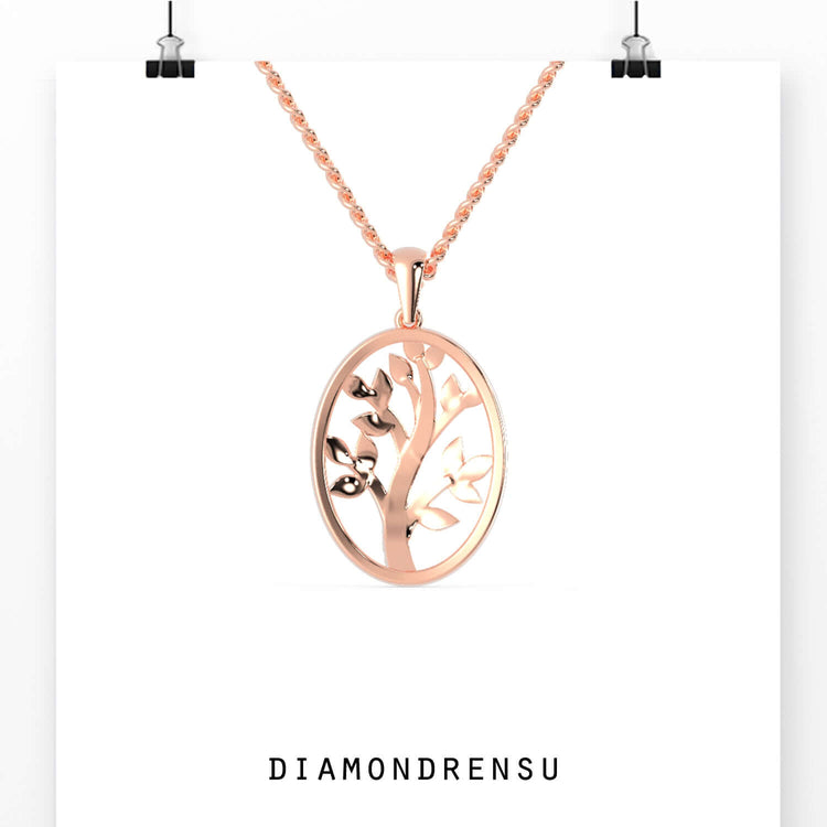 Designer tree of life pendant in yellow gold with round cut diamond.
