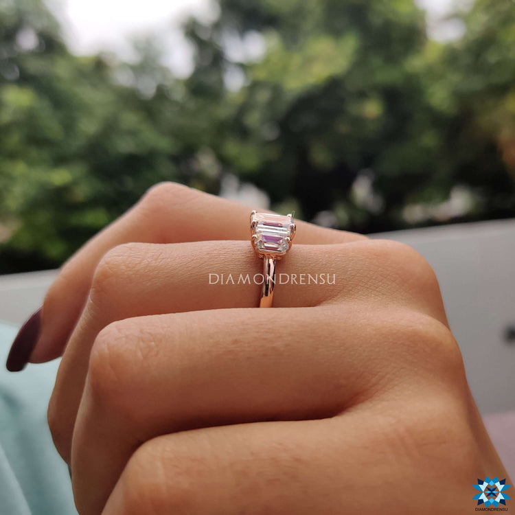Handmade jewelry with three emerald cut moissanites.
