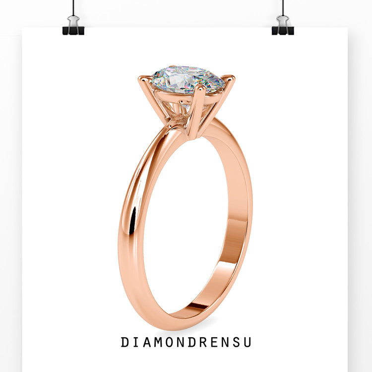 Simple oval solitaire ring with tapered band.
