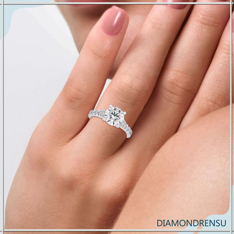 Round cut pave band ring in yellow gold with peekaboo diamond.
