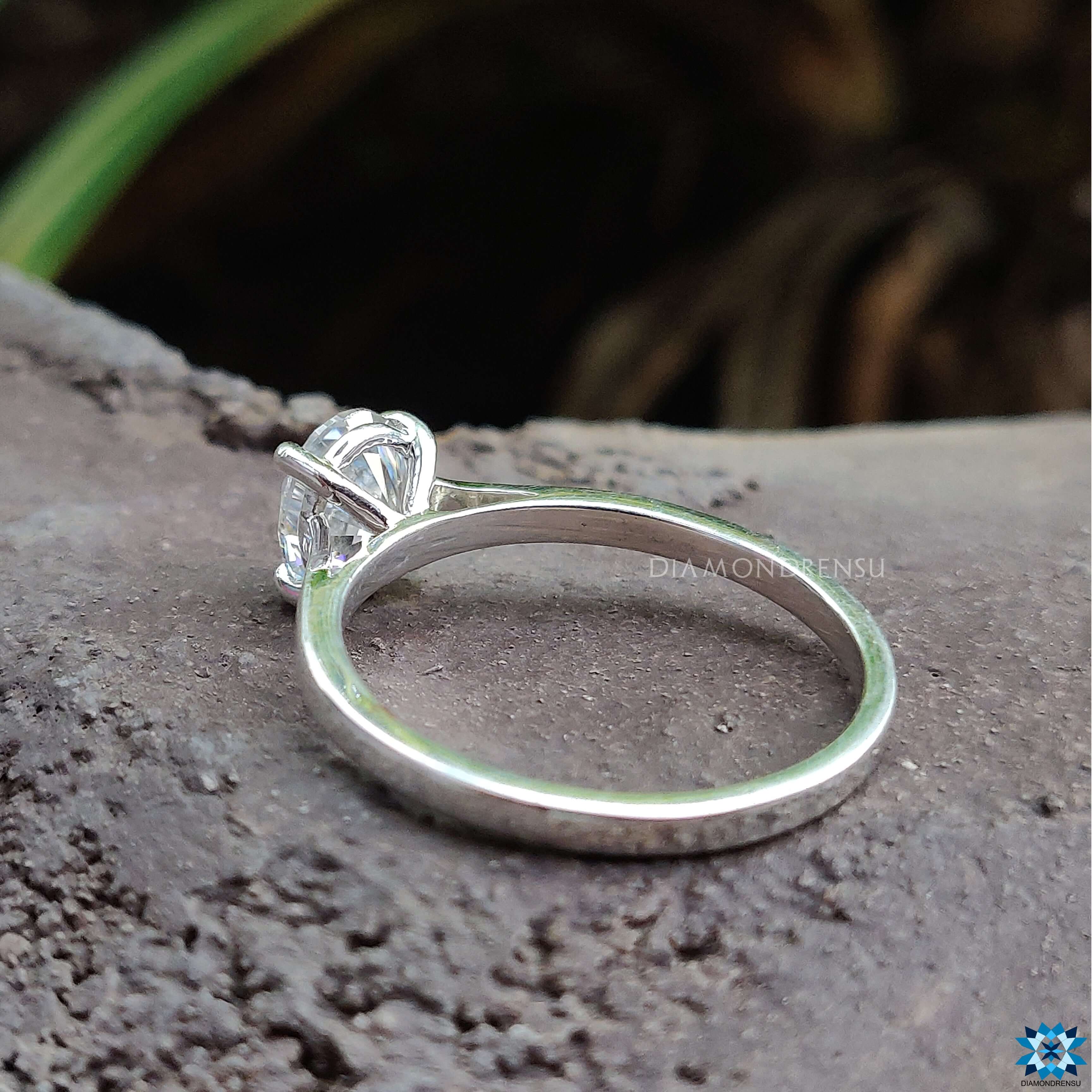 White gold engagement ring featuring an oval moissanite for engagement ring.
