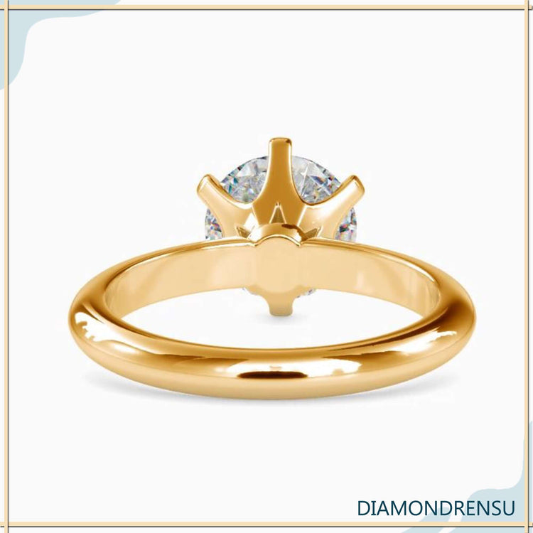 Handmade round solitaire engagement ring UK.

