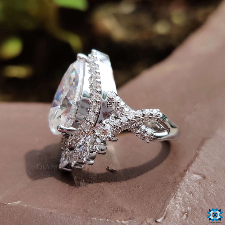 Custom engagement ring with prong setting and halo design.

