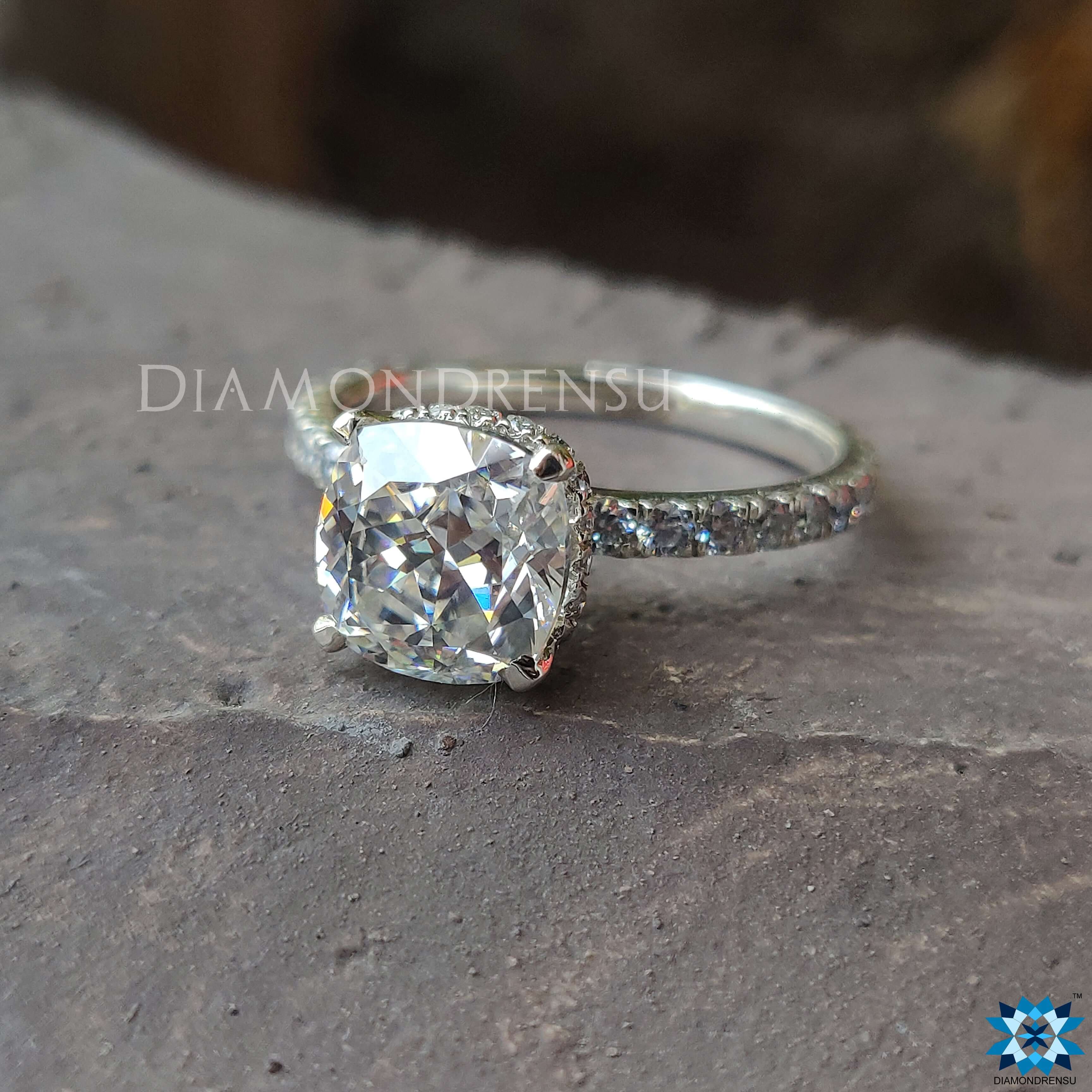 Hidden halo ring with a beautiful cushion cut moissanite stone for extra sparkle.