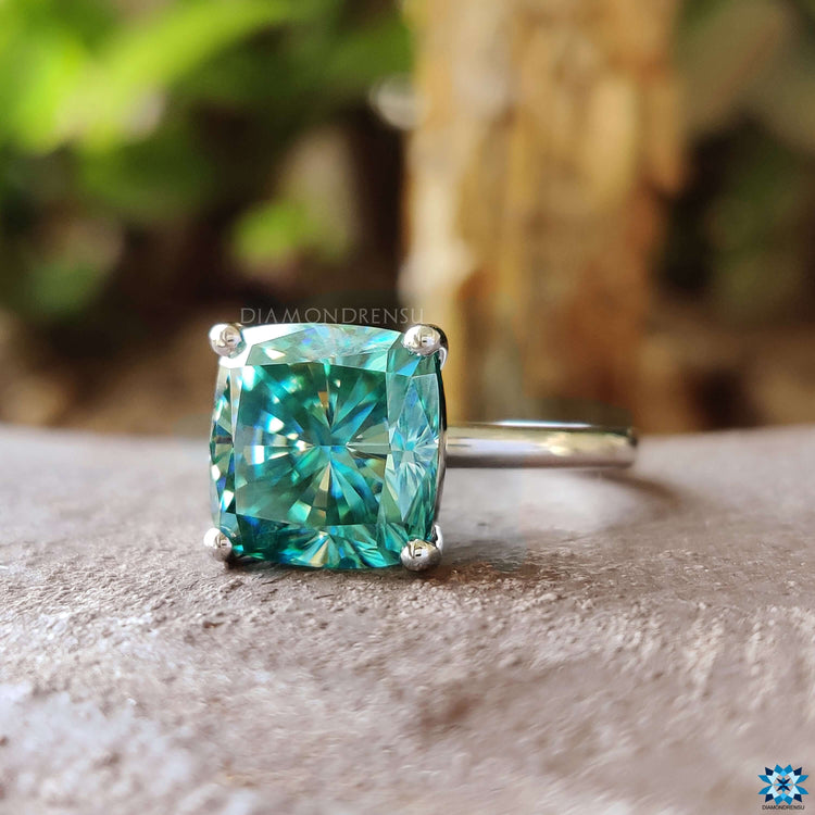 White gold engagement ring with cushion moissanite.
