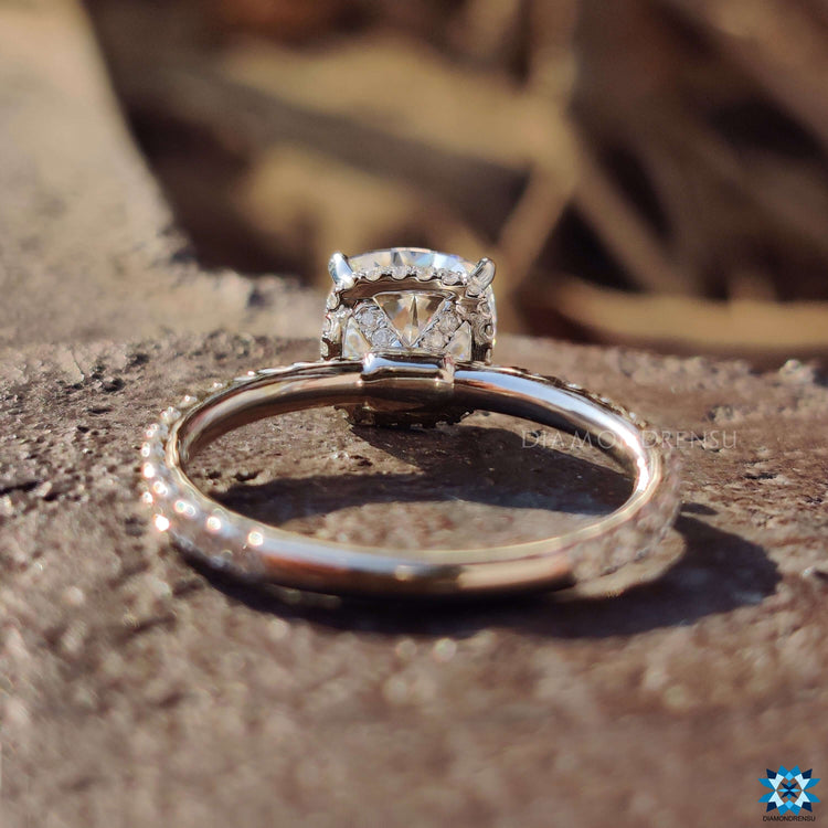 Custom engagement ring featuring cushion divine cut moissanite.
