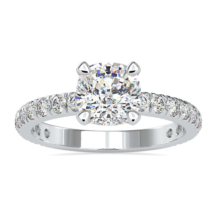 Cushion cut diamond ring with prong setting in white gold.
