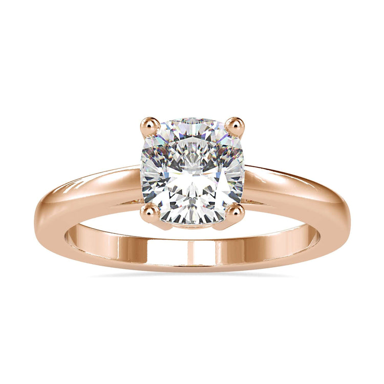 Cushion cut diamond solitaire ring in a 4 prong setting, crafted as a handmade jewellery piece.
