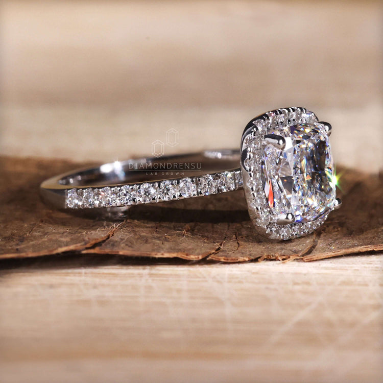 Cushion cut diamond ring 2 carat paired with a pave band for added brilliance and charm.
