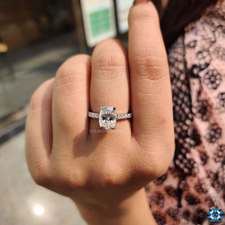 Elongated cushion divine cut moissanite ring.
