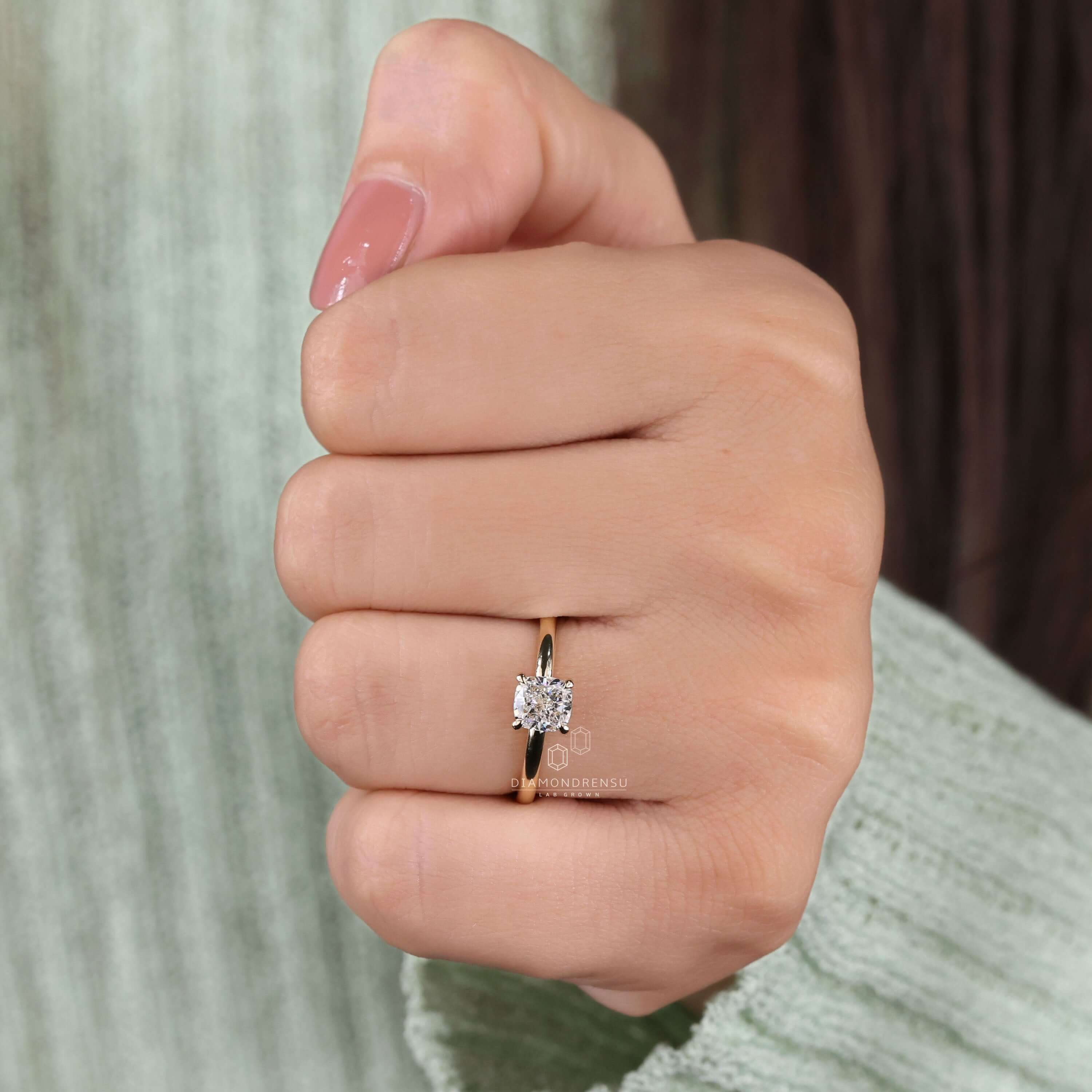 Claw prong setting engagement ring for women, designed with a cushion cut diamond for a unique and memorable proposal.
