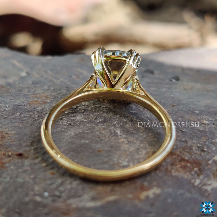 Custom engagement ring featuring cushion old European cut stone.
