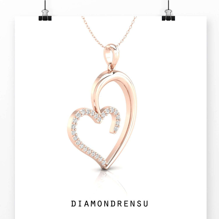 Designer heart pendant in white, yellow, and rose gold.
