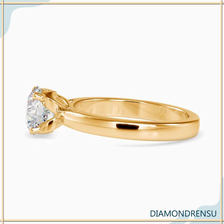 Diamondrensu UK ring with round solitaire and handmade finish.
