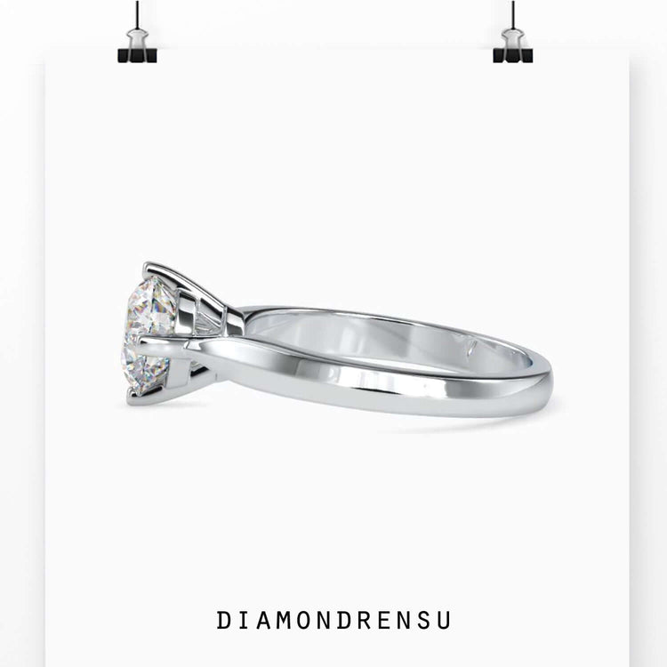 Rose gold designer ring with simple basket setting.
