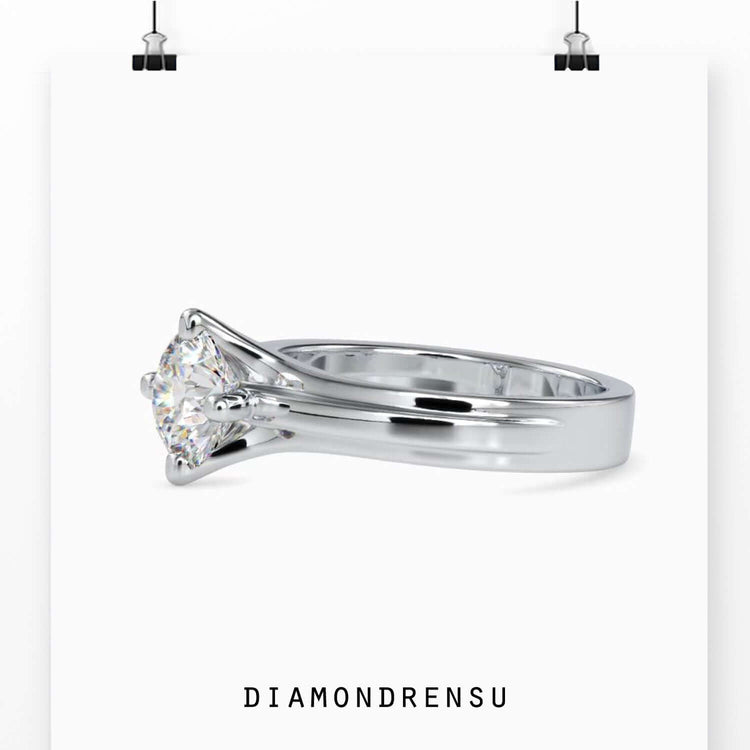 Designer ring with lab grown diamond in a compass prong setting.
