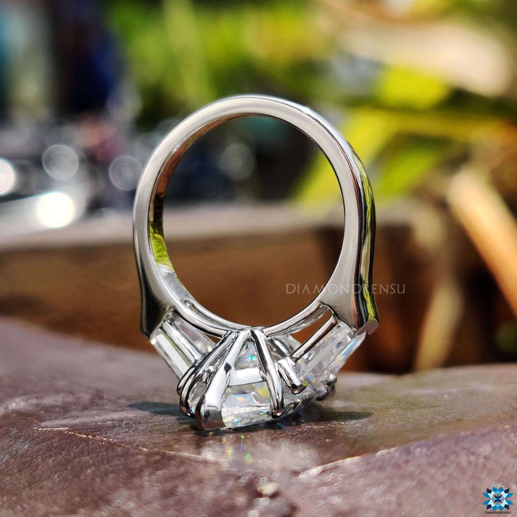 Marquise and bullet cut moissanite engagement ring in white gold.
