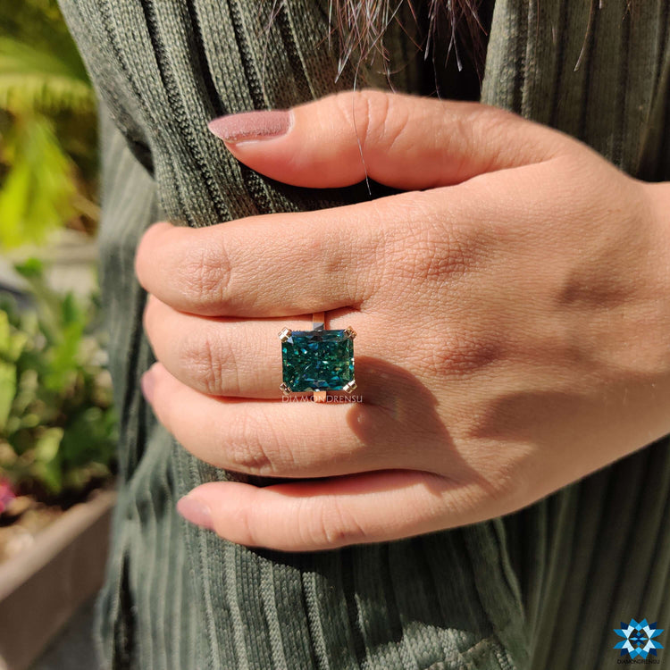 Radiant cut moissanite ring in classic prong setting.
