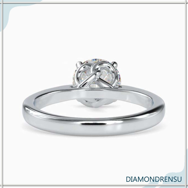White gold engagement ring with solitaire lab diamond.
